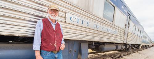 ASTA board Chairman Ben Sargent leads a tour of the City of Chicago car. The railway car will be the steam train associationu2019s 11th passenger car once it is completed.
