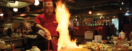 A chef at Tokyo Steak House prepares dinner for seven.