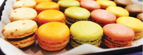 Macaron cookies, made from almond flour, come in a variety of soft pastel colors.
