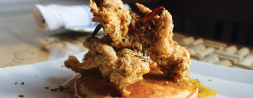 The fried quail appetizer is served with a corncake, honey and rosemary ($9).