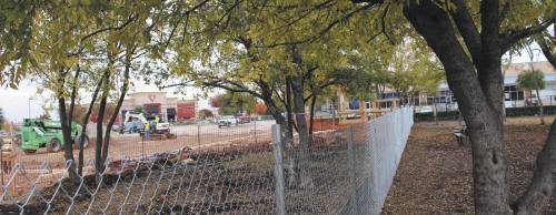 The western portion of the Canine Commons dog park (left of fence) is being replaced by a Total Wine & More building.