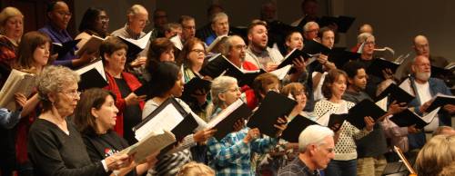 Houston Choral Society members rehearse for an upcoming performance at The Foundry Church.