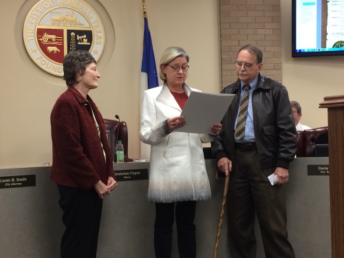 Tomball Mayor Gretchen Fagan (center) proclaims Dec. 5, 2016, as Dr. Hayne Sheffield Day. Sheffield (right), an ophthalmologist, was honored by the Tomball City Council for his long-time service to the community and his practice. 