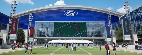 Fans gather outside The Ford Center at The Star in Frisco during the kickoff event Aug. 27.