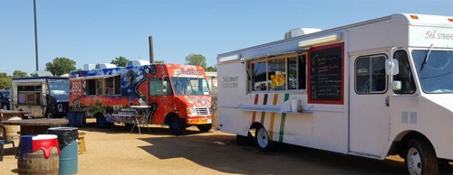 Different food trucks offering a variety of food line up at Frisco Rail Yard.