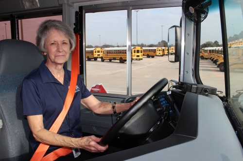Spring ISD bus driver Andrea Crafton prepares to pull out of the transportation bus lot.