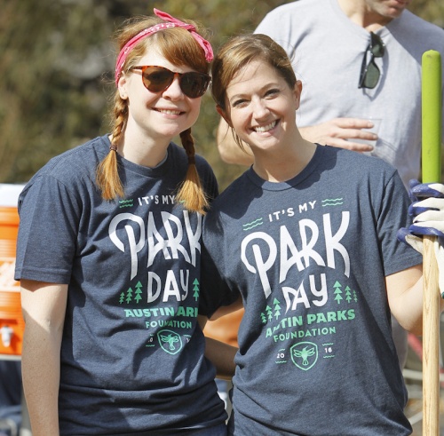 Volunteers help clean a parks during last year's event.
