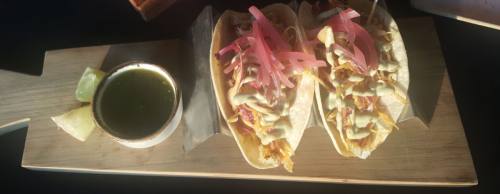 The baru2019s Gulf Shrimp Tacos are made withnTexas coleslaw, avocado crema and roasted salsa.  n