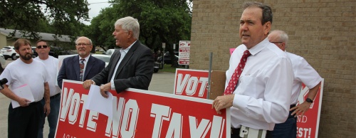 Former Austin City Council Member Don Zimmerman (right) joined members of the Travis County Taxpayers Union and other bond opponents recently outside Round Rock ISD's administrative office. 