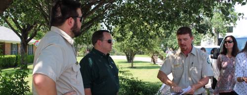 Clay Bales (third from left), a Texas A&M Forest Service forester and oak wilt specialist, discusses the disease during a field tour in Westlake on June 23.
