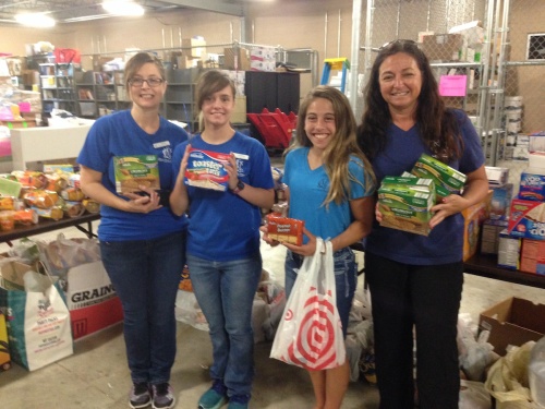 Society of Samaritans volunteers package 200 summer snack sacks each week for families within Magnolia ISD.