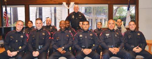 Harris County Precinct 4 Constable Mark Herman, center back, recently swore in four new deputies and promoted eight supervisors.