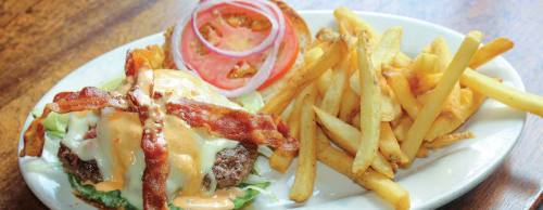 The Mou2019s burger ($13.99). This burger is layered with corned beef, Swiss cheese, a creamy sauce and other toppings.