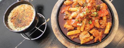 Dak-galbi is Hoodadaku2019s signature dish and can be served with cheese fondue ($18).