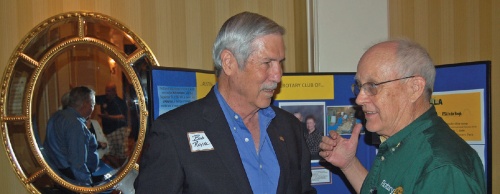 Gary Cataldo (right), Rotary Club Austin-Southwest president, speaks with club member Bob Royal at a June 17 event.