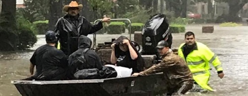 The Harris County Precinct 4 Constable's Office used boats and rescue vehicles to help residents trapped by floodwaters.