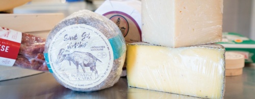 The shop offers a variety of cheeses.