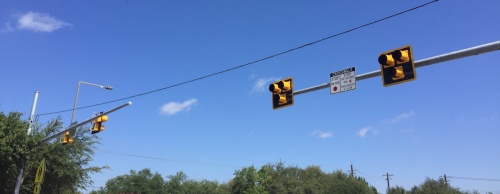 The pedestrian hybrid beacon coming to the intersection of Steiner Ranch Boulevard and Grimes Ranch Road will be similar to the traffic lights near the entrance to Steiner Ranch Elementary on N. Quinlan Park Road, said David Greear, Travis County assistant public works director.