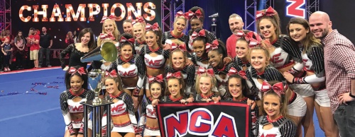An all-star cheer team from Woodlands Elite Cheer competes at a National Cheerleading Association competition. 