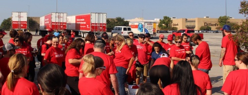 Keller Williams Realty employees gather at Barton Creek Square Mall on Sept. 1 to volunteer as part of the KW Cares program. 