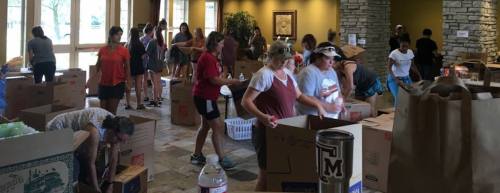 Volunteers gather to serve the community after Hurricane Harvey. 