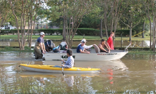 Residents shared boats to retrieve items from flooded homes in the Kelliwood subdivisions Sept. 1.