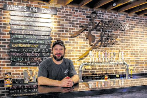 Dave Fougeron, co-founder of Southern Star Brewing Co., stands in the breweryu2019s on-site taproom.