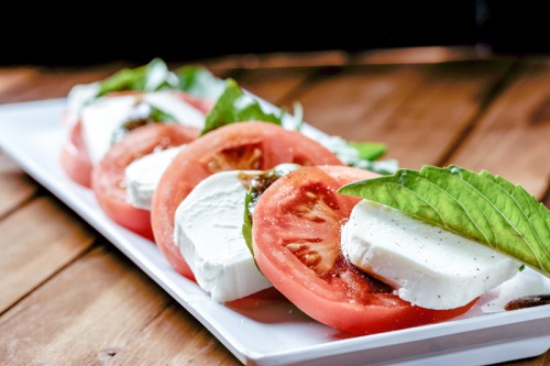 Caprese salad ($9.99): Freshly sliced tomato and mozzarella cheese are topped with basil and balsamic vinaigrette.
