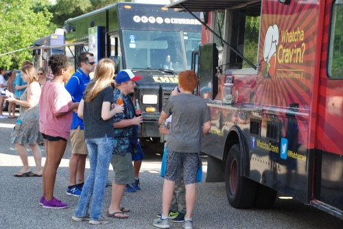 The neighborhood event on Oct. 13 includes food trucks and games.