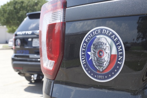 A Hutto Police vehicle sits outside City Hall.