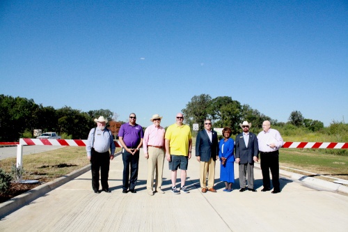 Lewisville City Council, Denton County Commissioner Bobbie Mitchell and State Rep. Ron Simmons hold a ceremony for the Valley Ridge Drive extension.