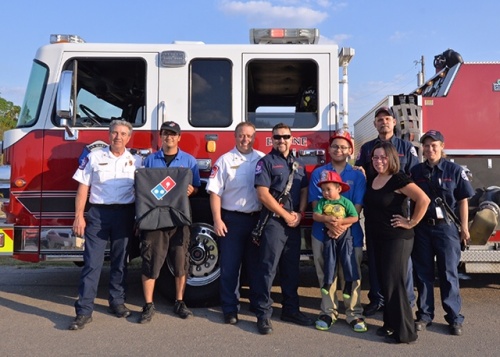 Dominos partners with the San Marcos Fire Department for Fire Prevention Month to bring pizzas to homes via fire truck. 