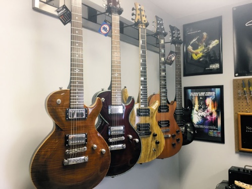  Nedd Guitars owner Mike Nedd stocks guitars in various styles and colors at his shop.