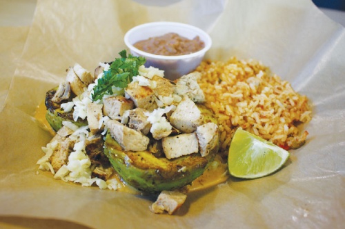 The Grilled Avocados ($11): This dish is a halved avocado that is topped with the protein of the customeru2019s choice, fresh cilantro and Jack cheese. The dish also features rice and beans and a lime wedge. 