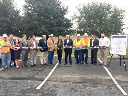 The Texas Department of Transportation joined Hays County commissioners Debbie Gonzales Ingalsbe, Ray Whisenant, Mark Jones and Lon Shell to cut the ribbon Nov. 3 on the ramp-reversal project for I-35 between RM 150 and the Blanco River.