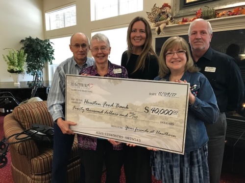 From left, The Oaks Gracious Retirement Living residents Juanell Deorsam and Don Holloway, Feeding Texas CEO Cecilia Cole, and The Oaks managers Pam and Rick Plummer.  