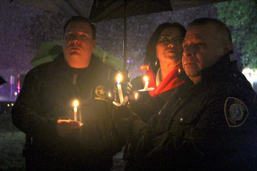 Despite the snowy weather, dozens of residents, law enforcement officials and public servants from San Marcos and the surrounding communities gathered in front of the Hays County courthouse with candles for the deceased police officer Kenneth Copeland. 
