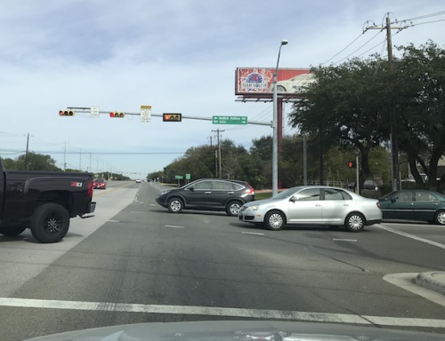A driver waits at the red light on RM 620 at RM 2222. The Texas Department of Transportation is planning improvements in the coming year to this often congested area.