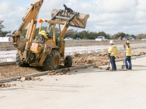 Construction crews work on a new westbound exit ramp from Hwy. 290 to Mueschke Road in Cypress in November.