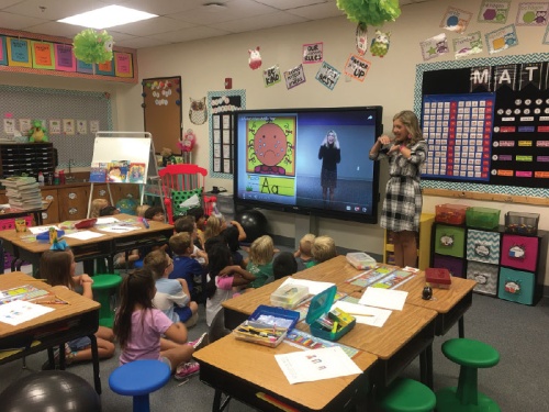 Bailey Buck, a teacher at Johnson Elementary School, uses the presentation station planned for teacher classrooms.