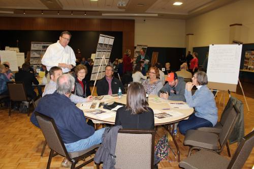 New Braunfels Mayor Barron Casteel speaks with one of the breakout groups at the last public visioning meeting for a 10-acre development project for South Castell Avenue.