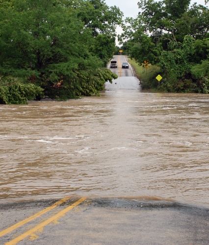Flooding like the one pictured here, at the Onion Creek double crossing of RM 150 in Hays County, have become familiar along Flash Flood Alley.