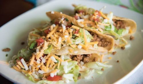 Tacos ($5.95-$6.95) The plate features three flour or corn tacos with beef and chicken fajita options.