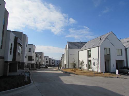 Completed townhomes for Westerly 360 (left side of the street) and The Walsh (right side of the street) in the Westlake area.