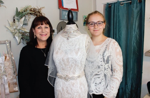 Owner Melinda Jacobs (left) opened Say Yes to the Re-Dress in July 2016.