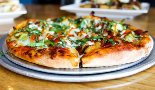  The Supernova is a pizza that features mozzarella, pepperoni, bacon, pineapple, mushrooms, garlic, jalapenos, basil, Sriracha sauce and ranch dressing.