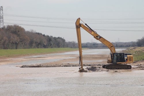 The Willow Fork Drainage District is dredging silt from its diversion channel in Katy.