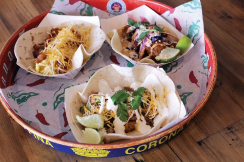 Popular tacos include chicken fajita (front, $3.50), fish (right, $3.75), and bacon, egg and cheese (left, $2.50).