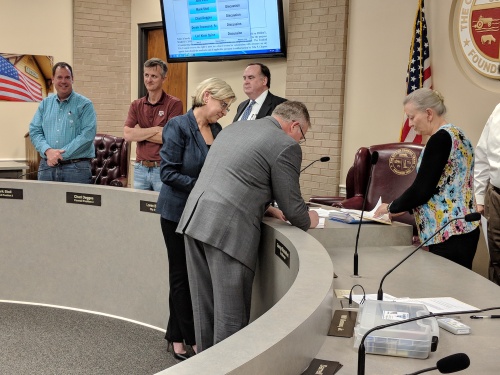 Tomball City Council unanimously voted to hire Assistant City Manager Rob Hauck (center) as the city's new city manager Friday, March 9.