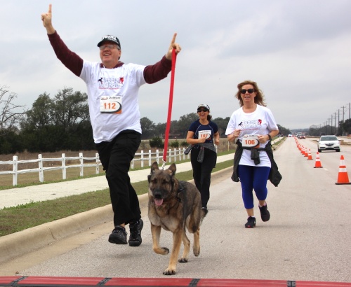 Participants in the Rescue Run 5K jogged alongside dogs.